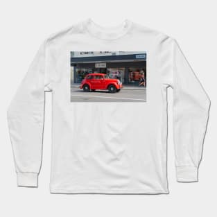 Red Morris 8 car in deco city of Napier New Zealand. Long Sleeve T-Shirt